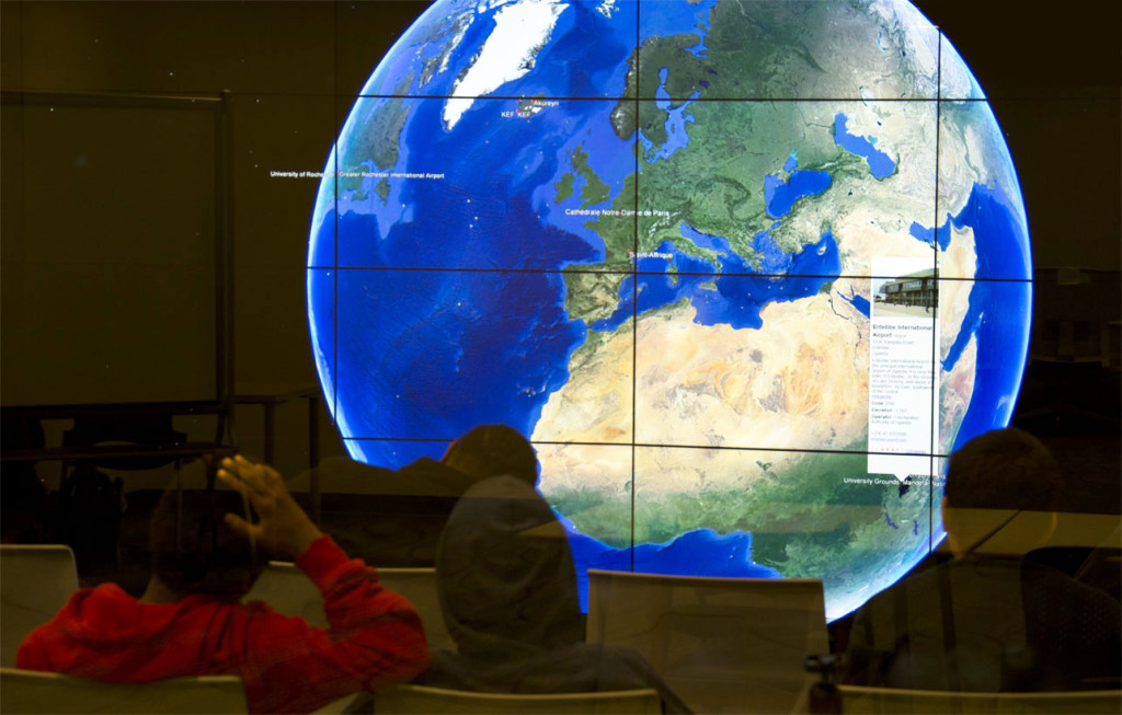 students viewing globe